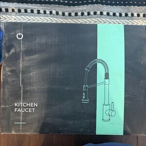 Sleek Black Kitchen Faucet with Pull-Down Sprayer and soap dispenser